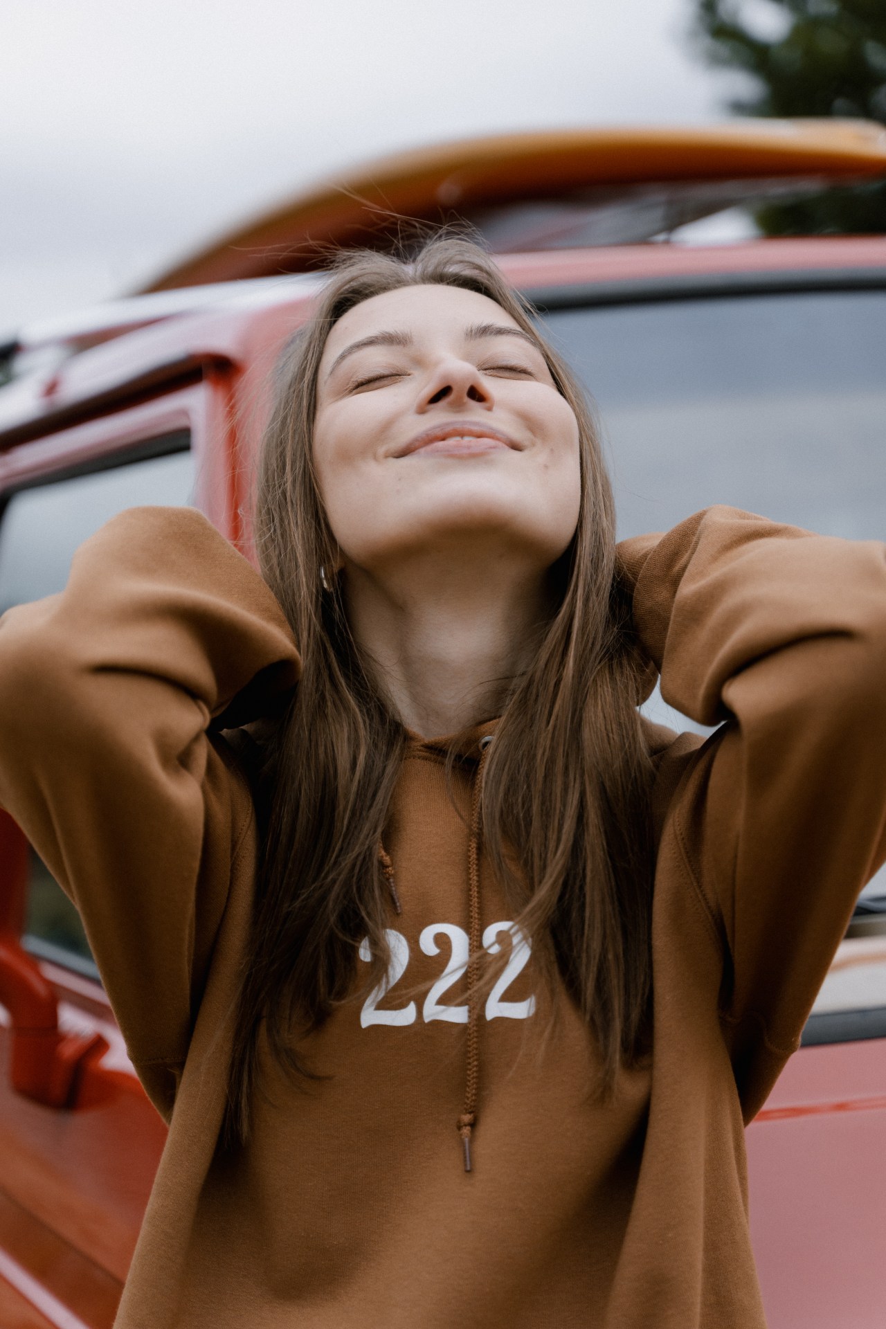 Girl Smiling in Hoodie in Sun