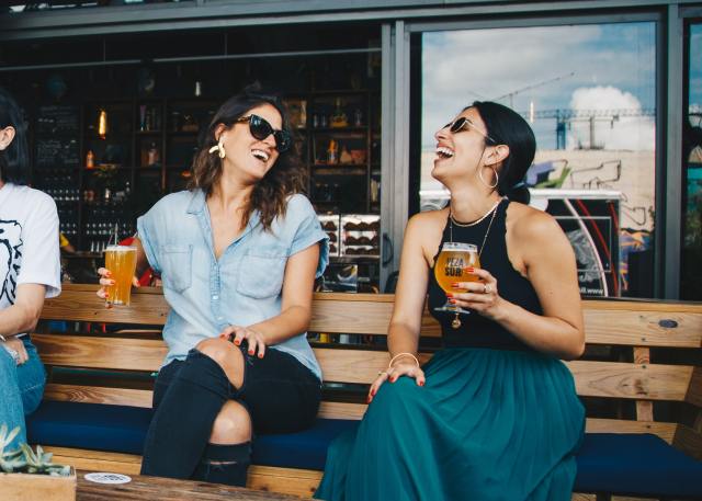 Women Laughing Drinks